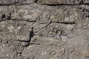 The texture of the old concrete stone wall. Background