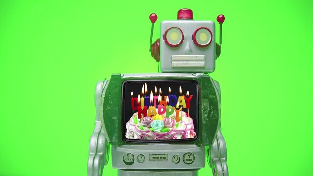 A retro tv  robot walks on with a HAPPY BIRTHDAY message  then walks off stop motion green screen 