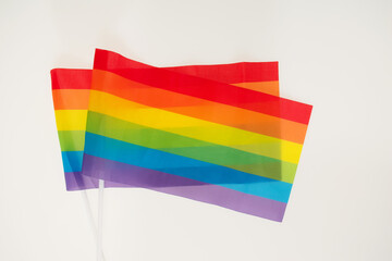 Two rainbow flags on white background