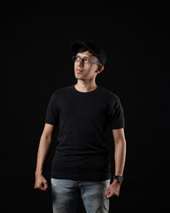 Young men in empty black T-shirts, stylish and posing like famous T-shirt models. Men's t-shirt template and mockup design for print. photo shoot models isolated black background.