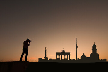Fototapeta na wymiar man in front of berlin city skyline in germany