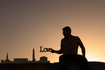 man in front of boston city skyline