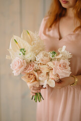 Naklejka premium girl holding wonderful flowers in her hands 