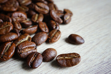 coffee beans on wooden table. roasted coffee beans, selective focus photo                                                          