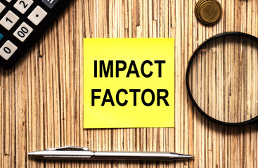 Text IMPACT FACTOR in yellow notes with pen