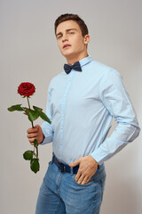 romantic man with red rose and light shirt pants suit
