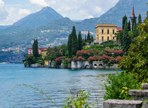 Stunning lake landscape with beautiful buildings and  ornamental flower gardens.Como Lake, Varenna, Lombardy, Italy