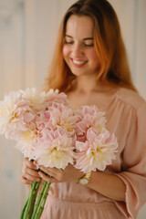 Asters in female hands a gift bouquet of flowers