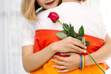 Happy Lesbian couples embracing each other, giving roses to each other.LGBT Lesbian couple love...