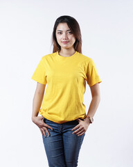 Front view yellow t-shirt Closeup on female body, woman girl in empty yellow t-shirt isolated on white background. Design woman t-shirt template and mockup for print.