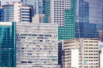 Residential area in old apartment with windows. High-rise building, skyscraper with windows of...