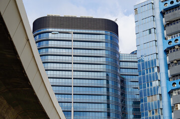 Residential area in old apartment with windows. High-rise building, skyscraper with windows of...