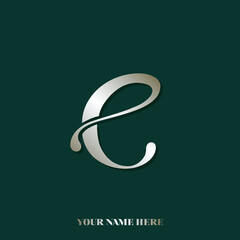 Lowercase letter e logo in shiny golden color, isolated on dark green background.Decorative calligraphic lettering icon.Typographic illustration.Alphabet initial.