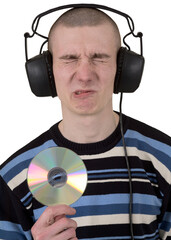 The young guy with ear-phones and a compact disk