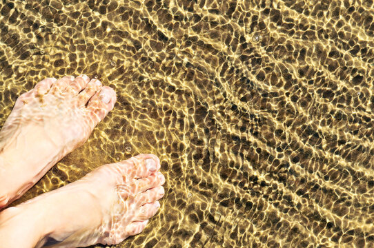 Feet In Shallow Water