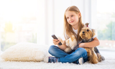 Girl and her companion terrier in light room