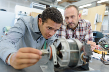 trainee engineer setting up a rotor