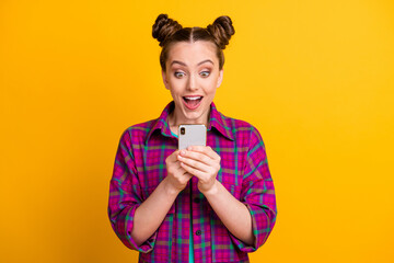 Photo of funny teen lady two buns hold telephone read positive good comments blog open mouth...