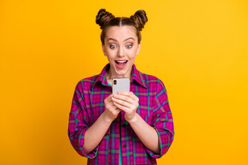 Photo of funny teen lady two buns hold telephone read positive good comments blog open mouth...