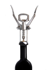 Corkscrew opening a bottle of wine