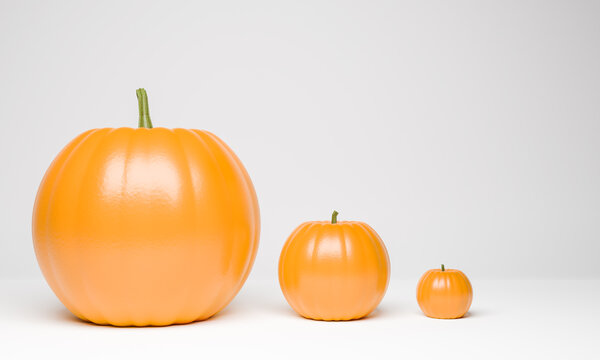 three pumpkins on a white background. Large, medium and small pumpkin next to each other. 3d render.