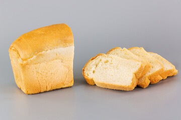 wonderful freshly baked bread cut into large pieces on a table