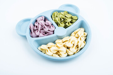 A plate of baby noodle butterfly noodles on white background