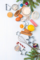 Ingredients for Christmas baking - flour, spices, eggs and cookie cutters.