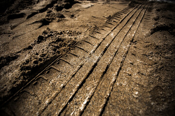 Wheel track on dirty mud
