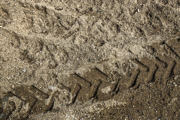 Wheel track on dirty mud