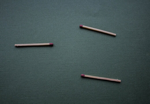 a three matches on a green background