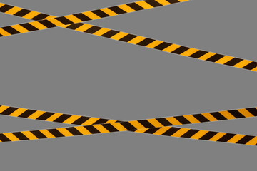 Black and yellow warning lines of barrier tape prohibit passage. Barrier tape on gray isolate. Barrier that prohibits traffic. Danger unsafe area warning do not enter. Concept of no entry. Copy space