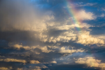 Naklejka na ściany i meble Storm cloud and rainbow for background