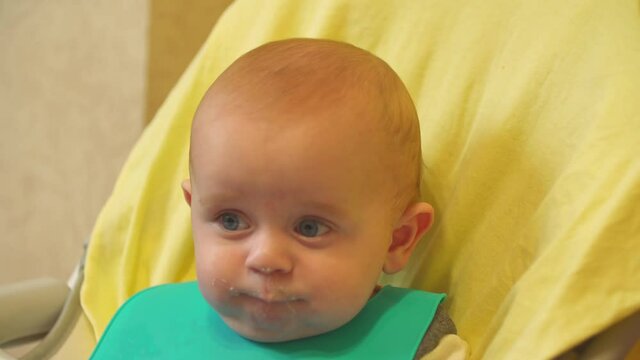 the baby is spoon-fed