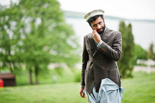 Beard afghanistan man wear pakol hat and jacket.