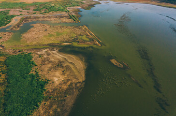 Nice photo of a piece of nature with water ground and some trees