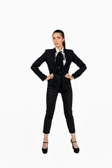 Full length portrait of a happy woman girl businesswoman posing in business suit blazer over isolated white background