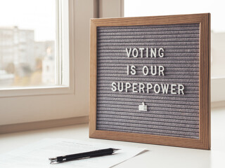 Letter board with phrase Voting is our superpower. Announcement of USA Presidential Election at 3rd...
