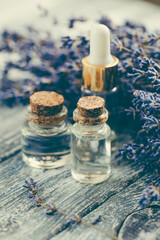 Bottle of essential oil on table. Selective focus.