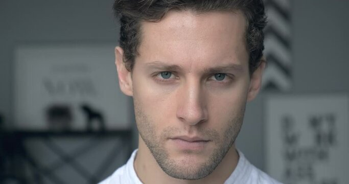 Portrait of young confident man looking at camera serious. Handsome milennial well-dressed good-looking attractive businessman. 