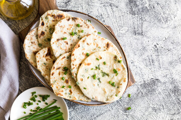 Onion naan - traditional indian bread. pita bread or scones with green onions