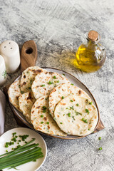 Onion naan - traditional indian bread. pita bread or scones with green onions