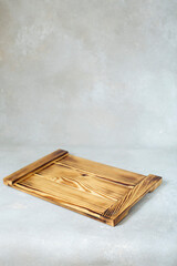 Wood cutting board on stylish rustic handwritten background