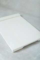 white cutting board on rustic handwritten background