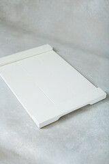 Fototapeta premium white cutting board on grey background
