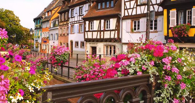 View on the street in Colmar, colourful buildings in romantic old town, summer. Alsace, France