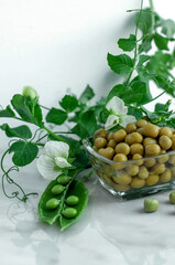 canned green peas on a white background with flowers