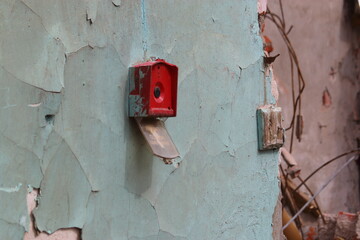red fire button in an abandoned house