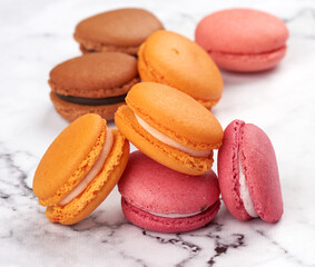 stack of baked macarons on a white table