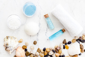 Fototapeta na wymiar Spa set bar of sea cosmetics - aroma oil and blue salt. Above view